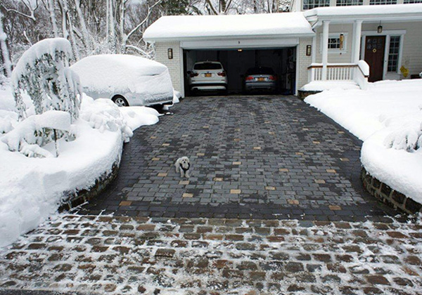 Radiant heated paver driveway after a snowstorm.